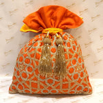Load image into Gallery viewer, Dupion Silk Honeycomb Jaali Orange / Yellow Embroidered Potli
