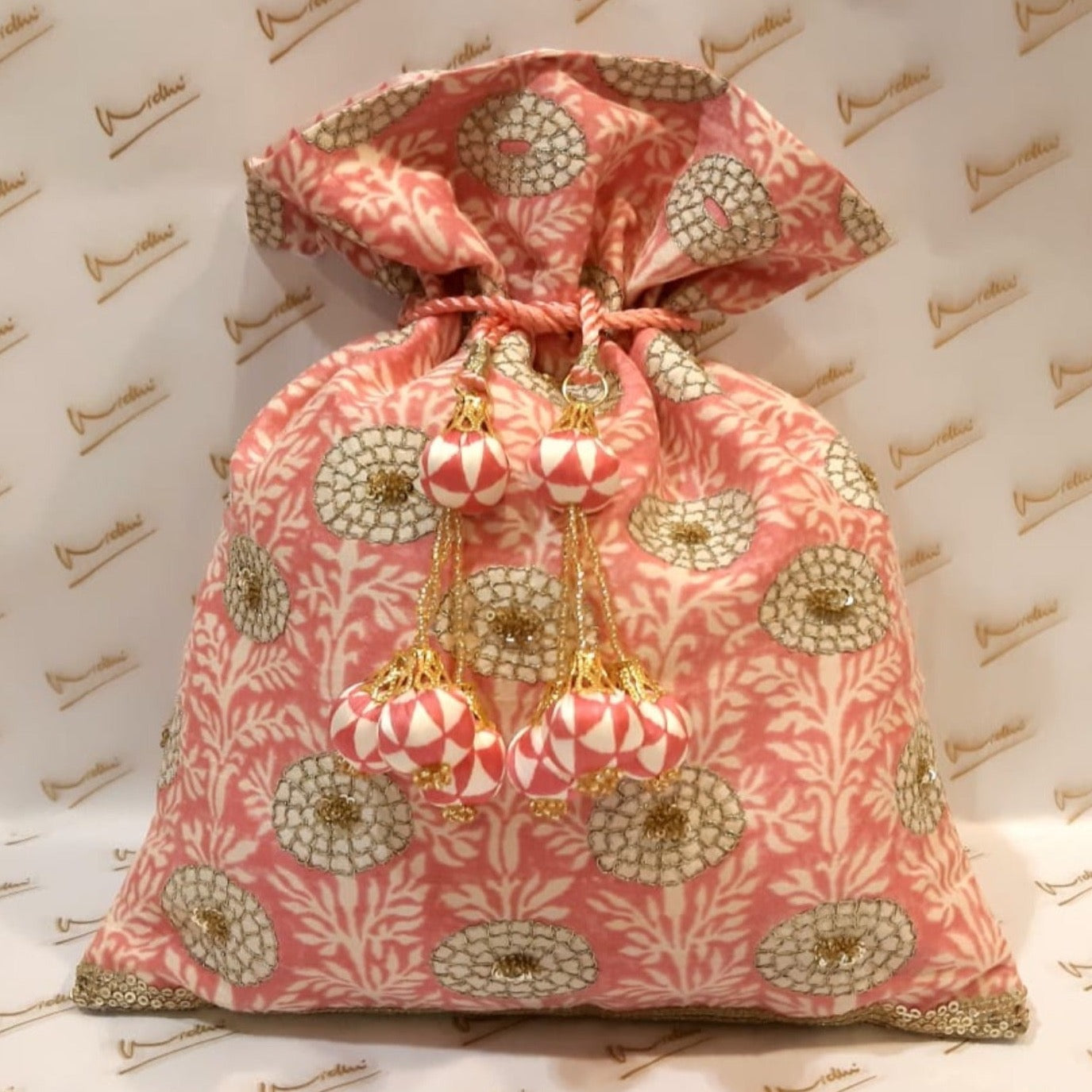 Dupion Silk Marigold Print With Sequins Highlighting Pink Potli